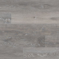 Close-up of MSI Cyrus Finely Luxury Vinyl Planks BOX (23.77 SQFT) shows grey and greige textured wood grain with subtle knots and shade variations; the CrystaLux™ wear layer adds durable, rustic style.
