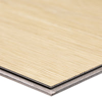 Close-up of overlapping Cyrus Lenexa Creek Luxury Vinyl Planks by MSI, featuring a light woodgrain top and gray base, showcasing waterproof flooring thats easy to install for DIY projects.