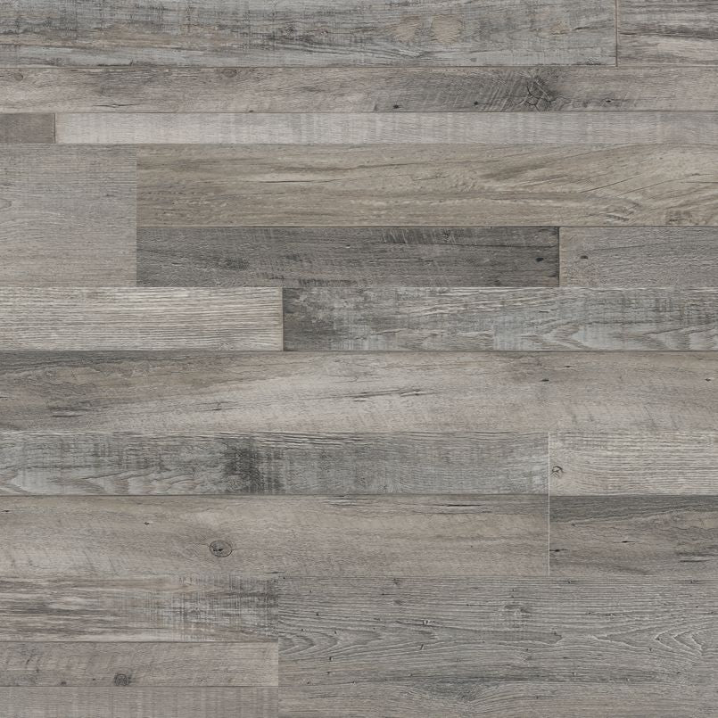 MSI’s Cyrus Mezcla Luxury Vinyl Planks BOX (23.77 SQFT) features gray wood-look planks in a staggered pattern with varied shades and textures for a rustic effect, plus a waterproof SPC core for lasting durability.