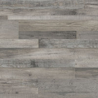 MSI’s Cyrus Mezcla Luxury Vinyl Planks BOX (23.77 SQFT) features gray wood-look planks in a staggered pattern with varied shades and textures for a rustic effect, plus a waterproof SPC core for lasting durability.