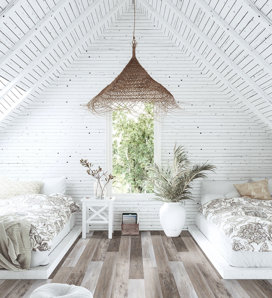 A bright attic bedroom with two beds, featuring MSI Cyrus Weathered Brina Luxury Vinyl Planks for a rustic wood look, white wooden walls and ceiling, large window with greenery, patterned bedding, woven pendant light, and potted plants.
