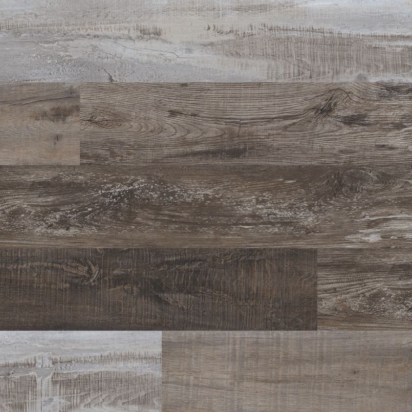 Close-up of MSI Cyrus Weathered Brina Luxury Vinyl Planks (23.77 sqft box) in varied brown and gray tones, featuring a rustic wood look with realistic grain. These planks are 100% waterproof, durable, and easy to install.