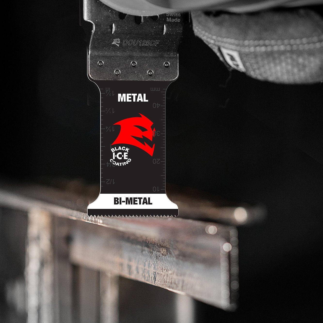 A close-up of a Diablo Steel Demon™ bi-metal oscillating blade, featuring an ultra-hardened cutting edge near a metal surface. The blade reads METAL and BI-METAL with the Steel Demon logo in bold red and black.