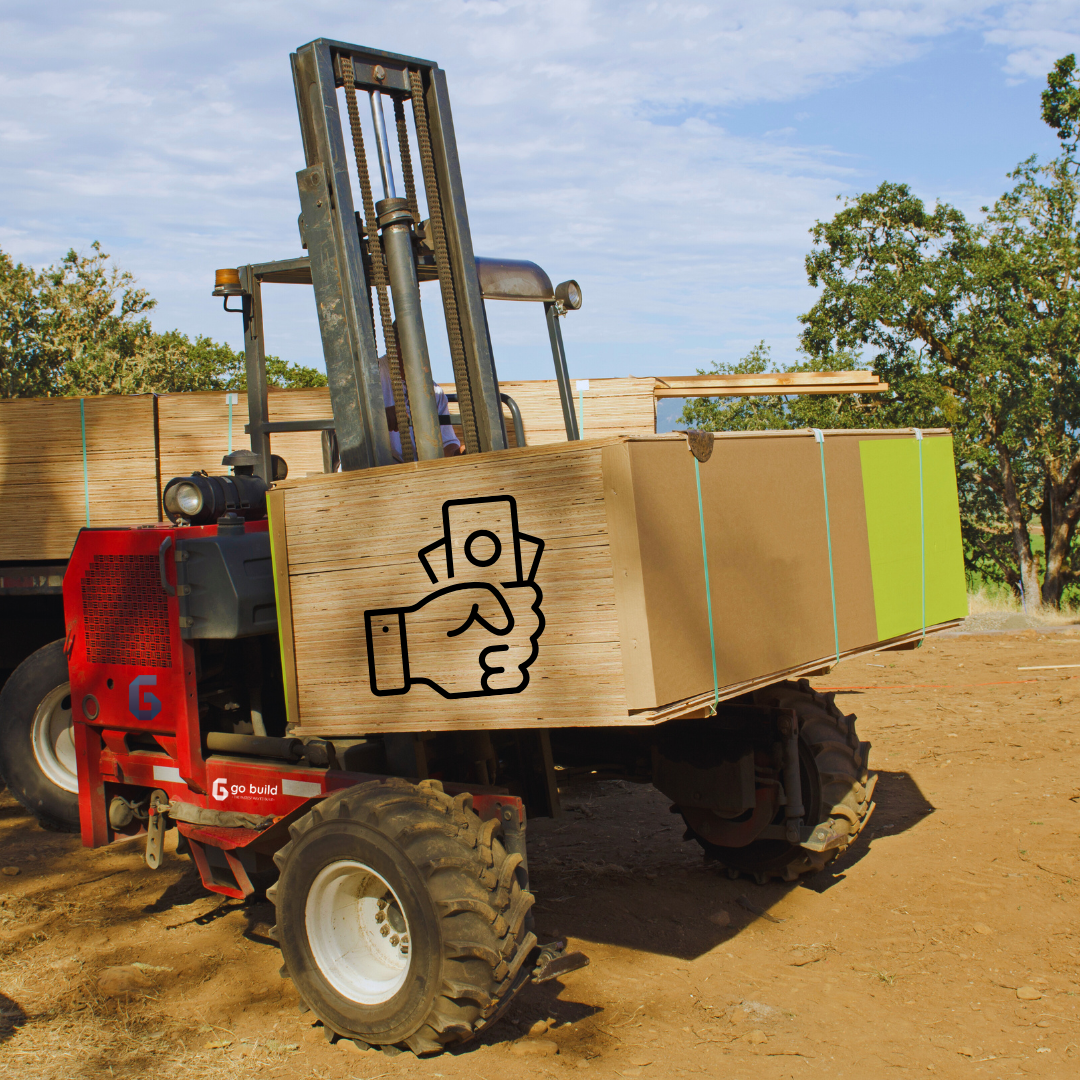 A red forklift transports large wooden crates, each bearing the Go Build credit fee logo. Theyre loaded on a dirt area set against trees and a blue sky, showcasing Go Builds quick construction solutions.