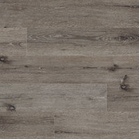 Close-up of MSI Cyrus Ludlow Luxury Vinyl Planks BOX (23.77 SQFT) in gray-brown, showcasing realistic wood grain and knots. Durable planks feature easy click-lock installation for a staggered, horizontal layout.