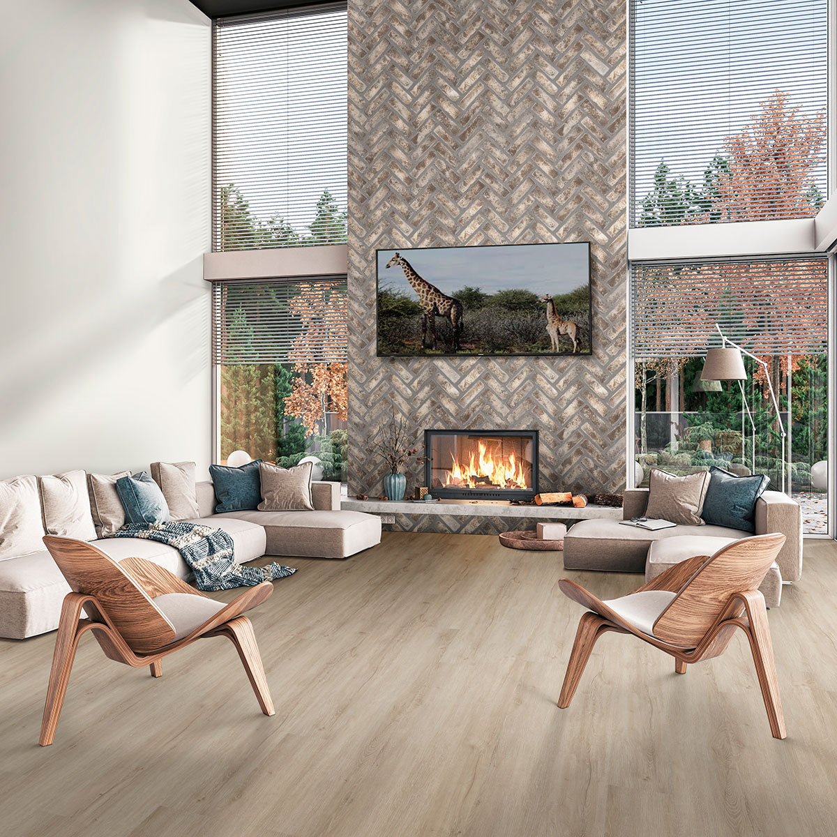 A modern living room features MSI’s Cyrus Sandino Luxury Vinyl Planks (23.77 SQFT/box), neutral furniture, wooden chairs, a fireplace with TV showing a giraffe scene, and large windows overlooking autumn trees. The floor offers waterproof SPC core durability.