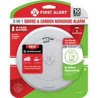 The FIRST ALERT 1046796 SMCO210 10-Year Battery Combo Smoke and CO Alarm with Slim Profile Design comes in red, white, and green packaging displaying key features.