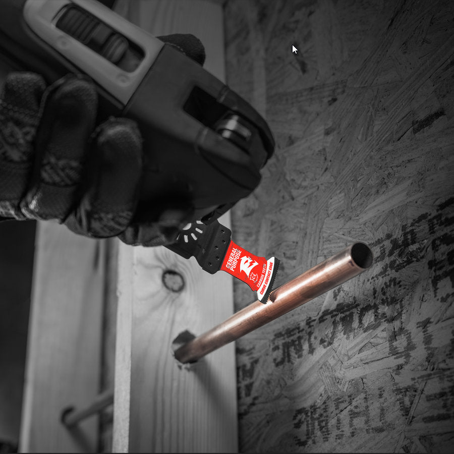 Wearing gloves, a person expertly uses a power tool with the Diablo DIABLO DOU125CGP Demo Demon™ oscillating blade to cut through metal on wood and plywood. The universal fit carbide teeth in red provide longer cutting life, standing out in the black-and-white scene.