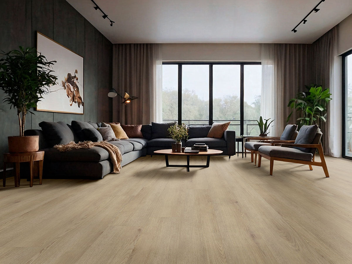 Modern living room features large windows, a dark sectional, armchairs, plants, and wall art. The stylish space showcases MSIs XL Cyrus Chester Hills Luxury Vinyl Planks (22.44 sq ft/box) for durable beauty.