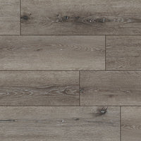 MSIs XL Cyrus Ludlow Luxury Vinyl Planks BOX (22.44 SQFT) features wide, greyish-brown planks with natural wood grain and knots, plus CrystaLux™-protected Rigid Core Flooring for a rustic look and long-lasting style.
