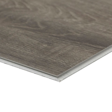 Close-up of an MSI XL Cyrus Draven Luxury Vinyl Plank (SPC) showing its dark, textured surface and beveled edges, waterproof design, against a white background. Box covers 22.44 sq ft.