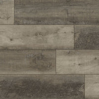 A close-up of MSI XL Cyrus Wolfeboro Luxury Vinyl Planks (22.44 SQFT/box) in gray and brown, showing rustic wood grain, knots, and texture in a staggered layout.
